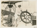Image of Nain Nurse at the wheel of the Bowdoin